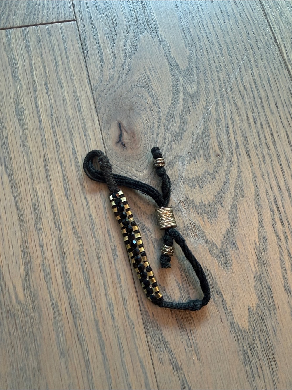 Shashi Black and Gold Braided Adjustable Bracelet